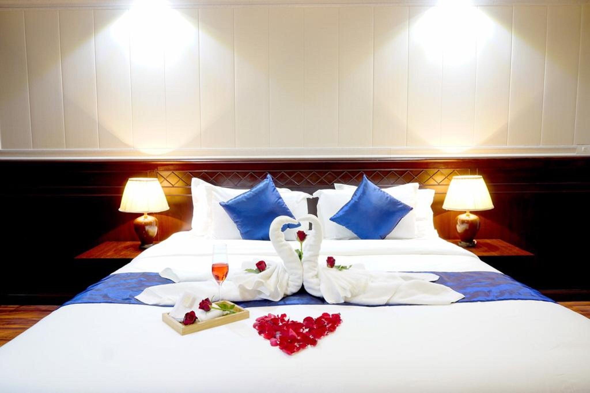 Miloft Sathorn Hotel - Sha Plus Certified Bangkok Exterior photo A bed with a heart-shaped arrangement of flowers